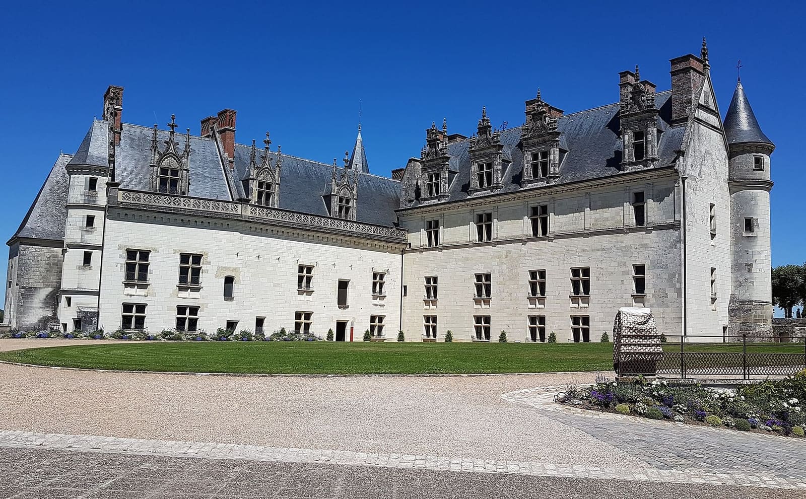the château's logis from the forecourt, under a blue sky