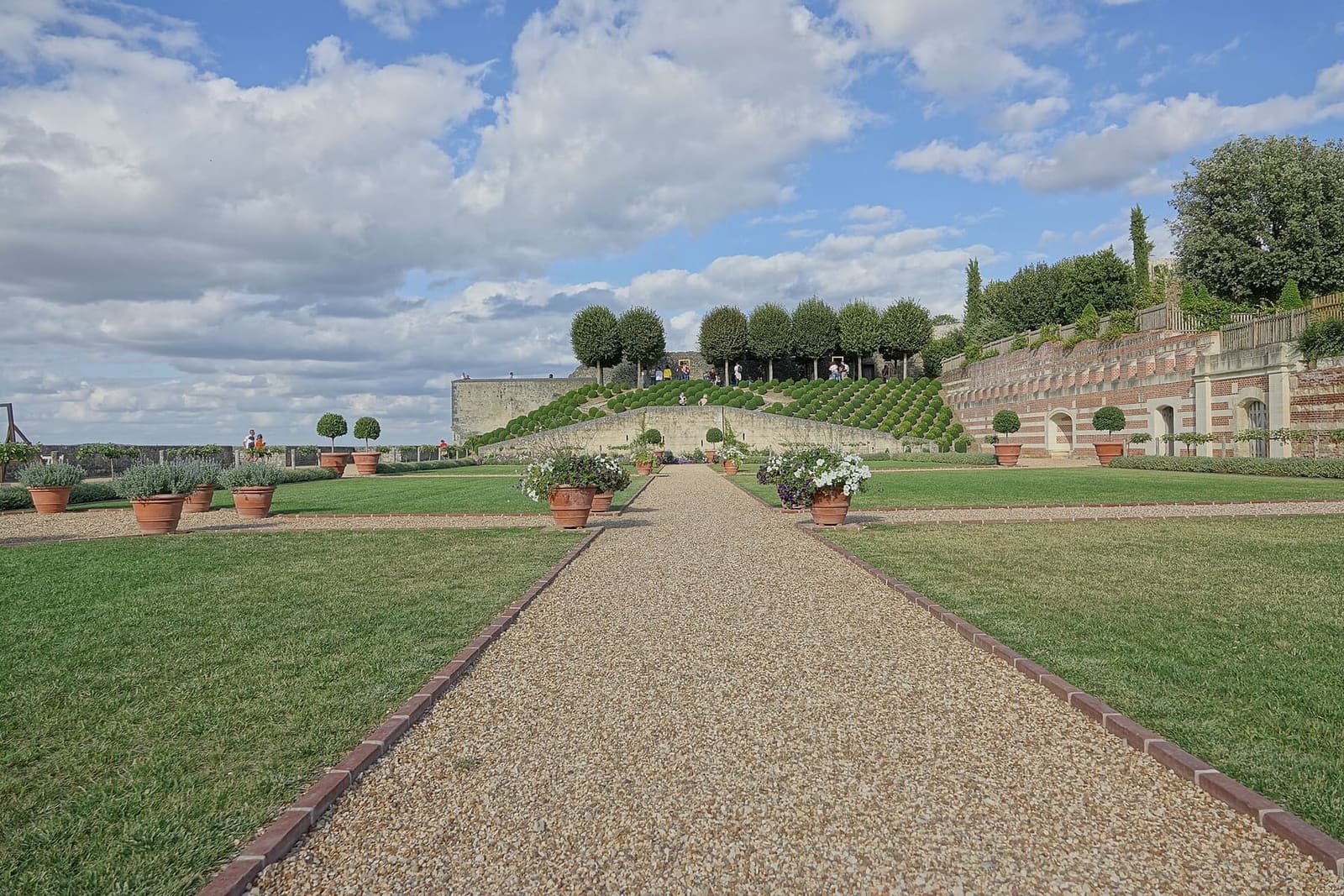the avenue of the château gardens, with planters and hedges