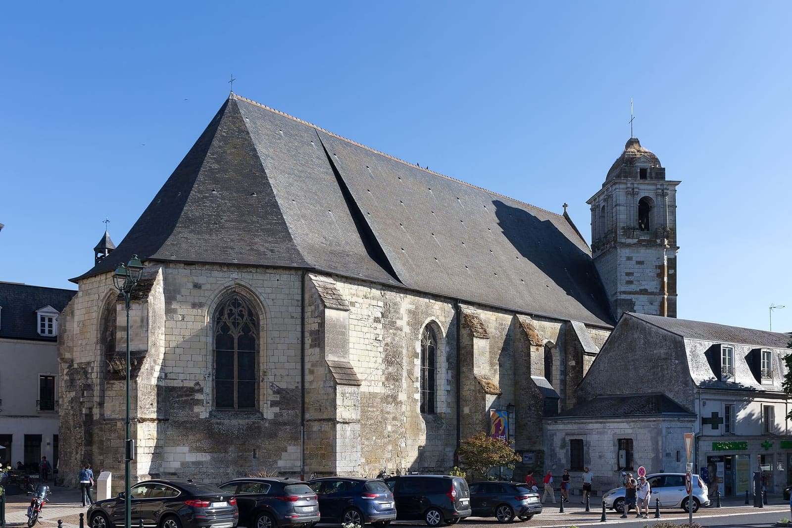 the Église Saint-Florentin with its bell tower, under a blue sky
