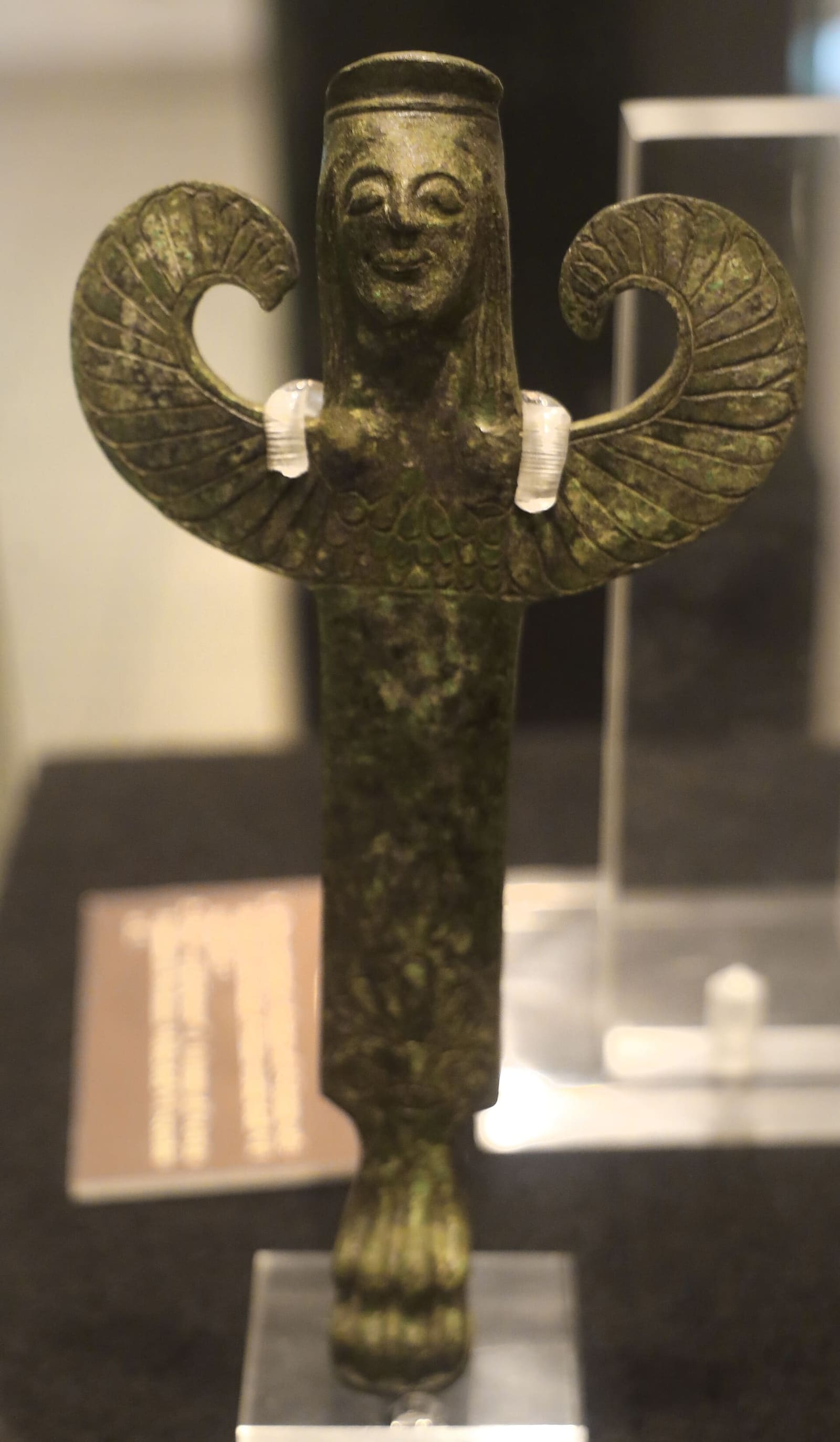 two bronze supports in the shape of winged sirens, from the sanctuary