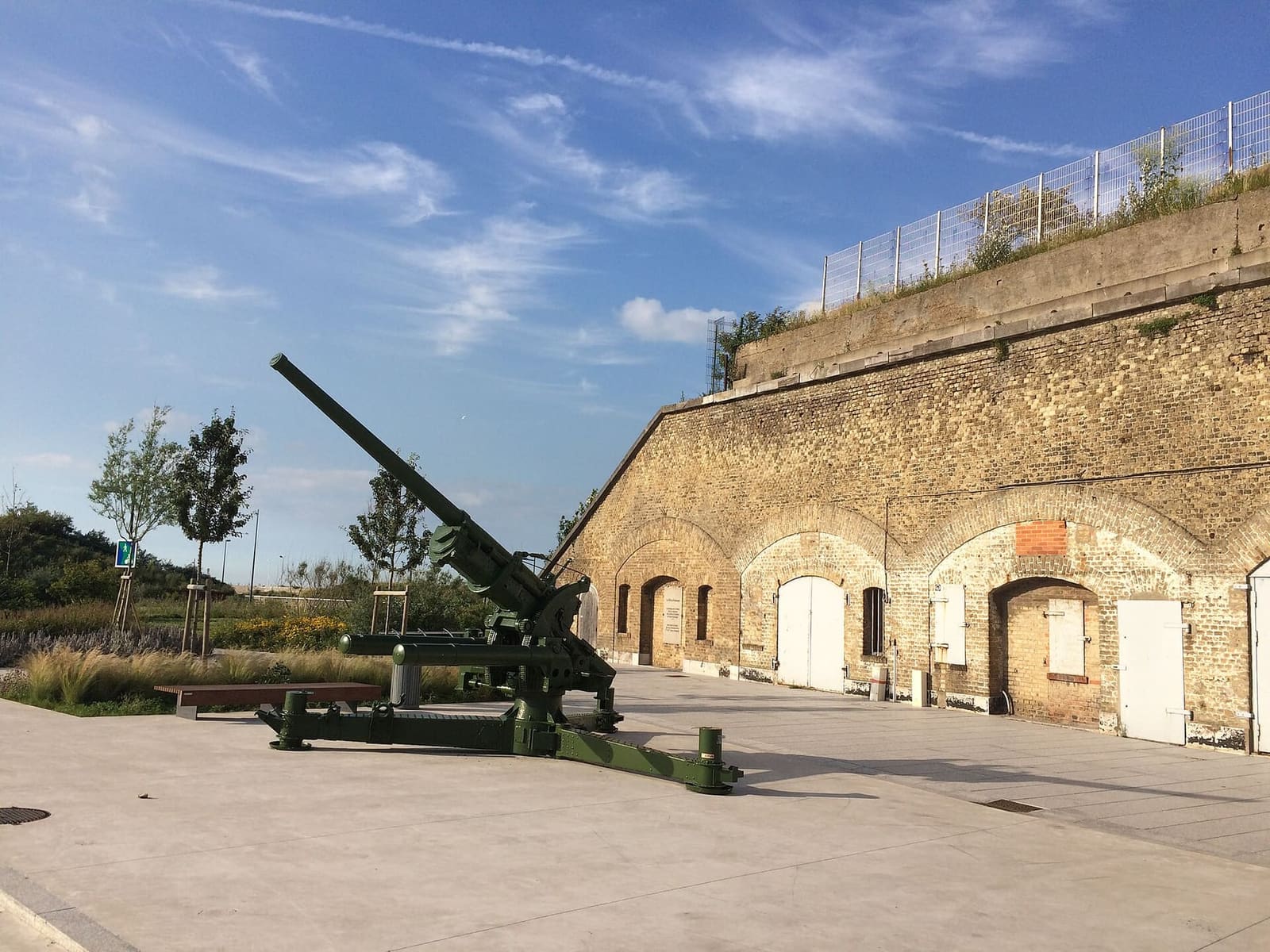 the brick arches of Bastion 32, home of the Dunkirk 1940 museum, with a gun in front