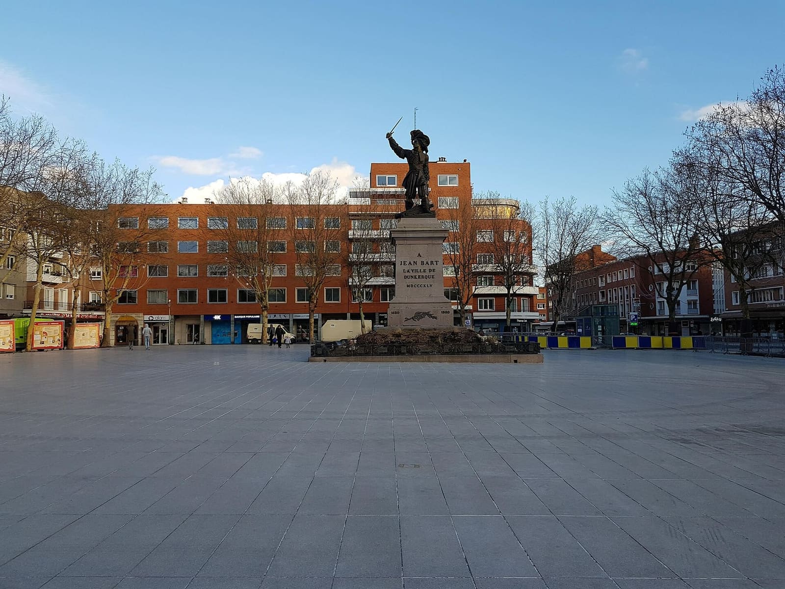 Place Jean-Bart empty on a winter morning, with the statue and the Reconstruction buildings