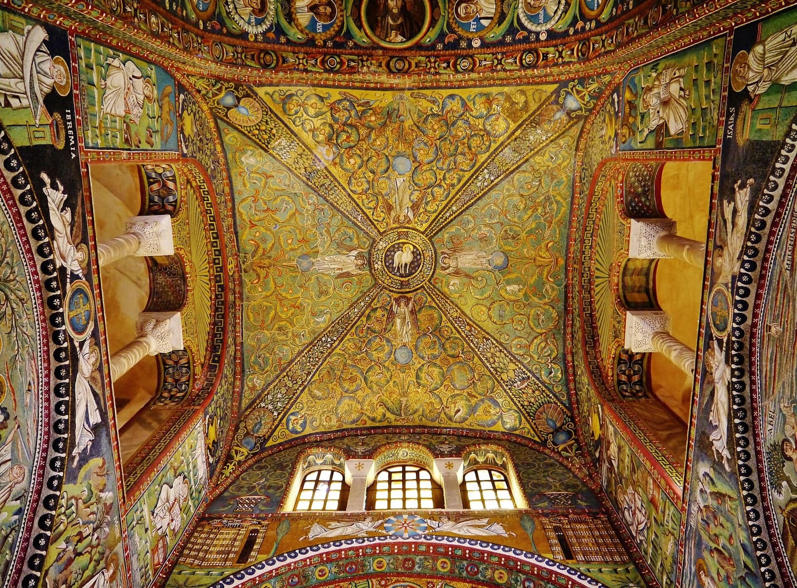 the vault of the presbytery of San Vitale with the Lamb in the centre held up by four angels among the scrolls of foliage