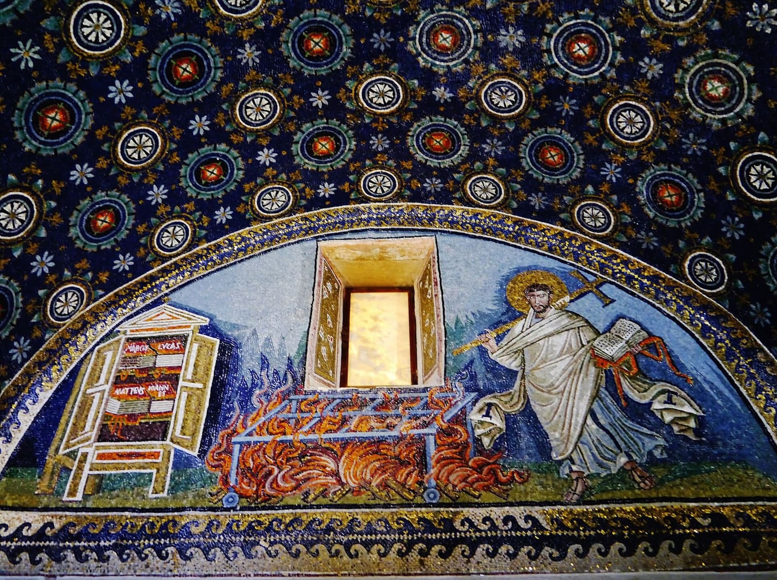 Saint Lawrence with the cross heading for the gridiron, with the cupboard of the four Gospels, in the Mausoleum of Galla Placidia