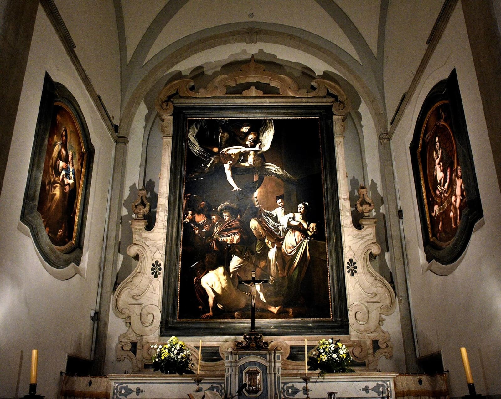 le Sette opere di Misericordia di Caravaggio sull'altare maggiore del Pio Monte della Misericordia