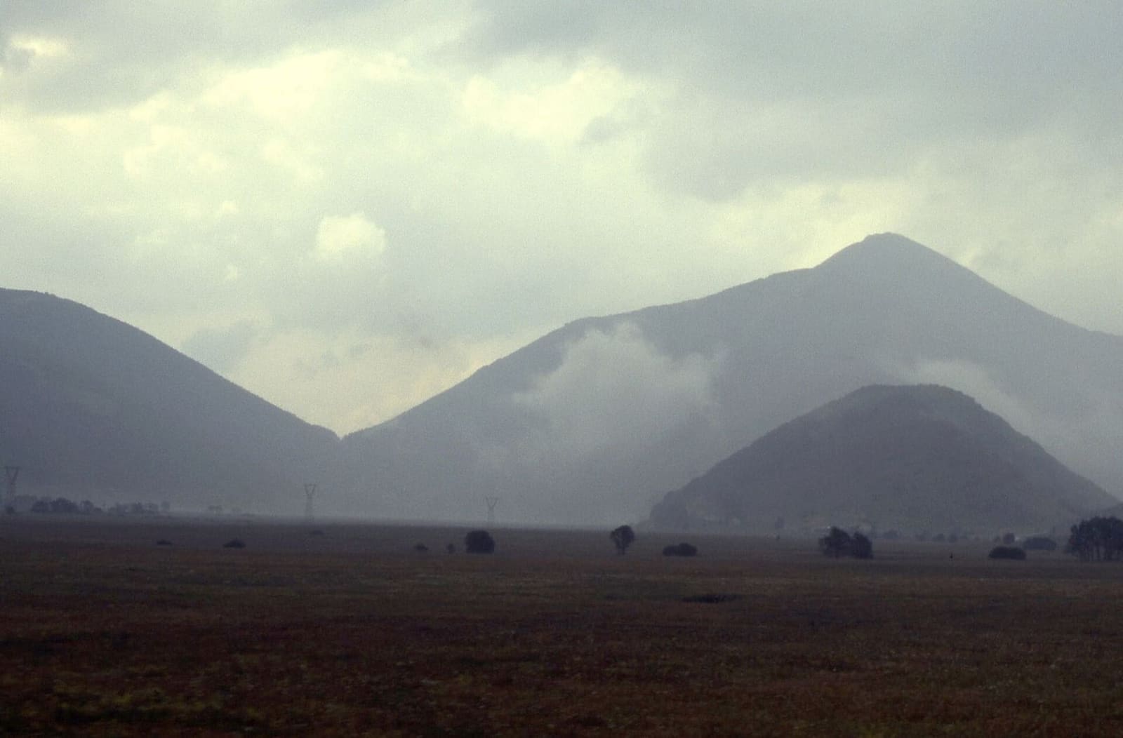 low clouds over the mountains seen from the train between Castel di Sangro and Campo di Giove