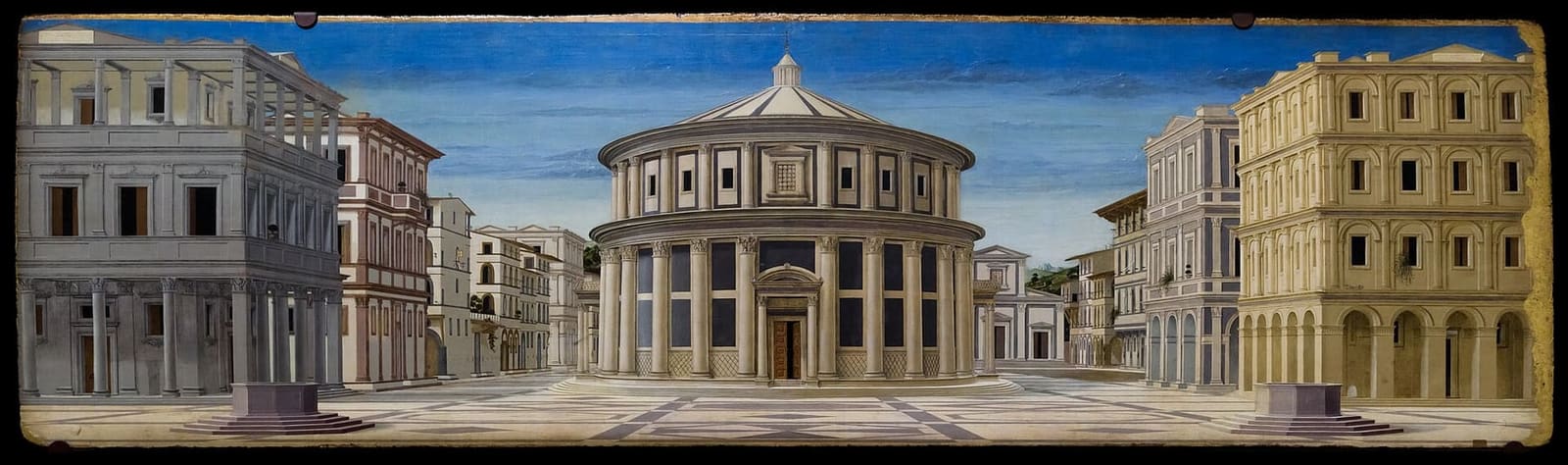 la tavola della Città Ideale, con il tempio rotondo al centro della piazza e i palazzi in prospettiva ai lati